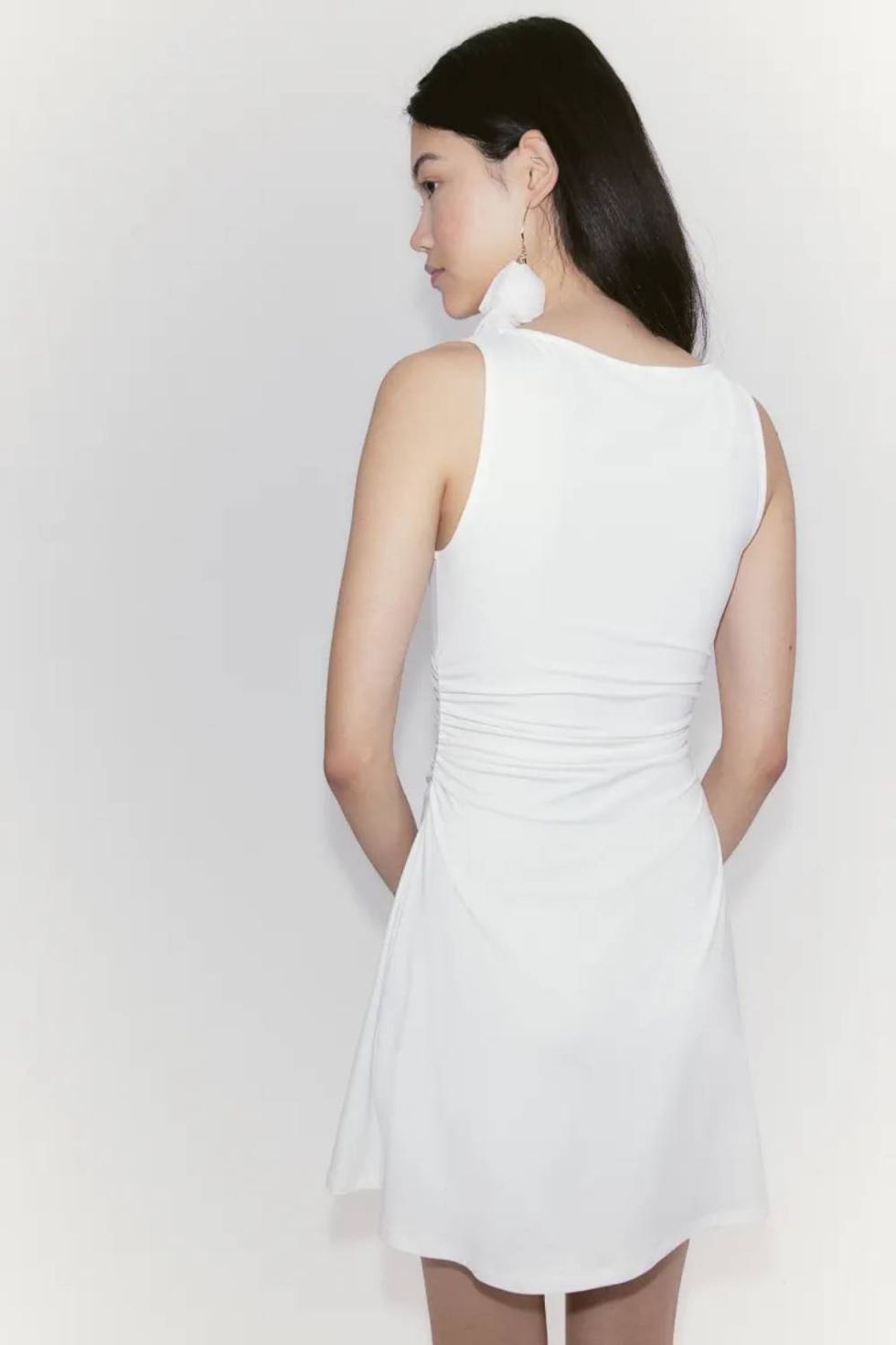 a woman wearing a white dress