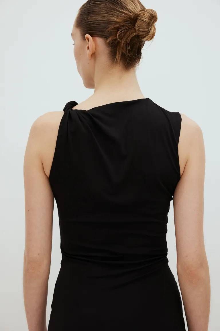 back of a person wearing a black dress