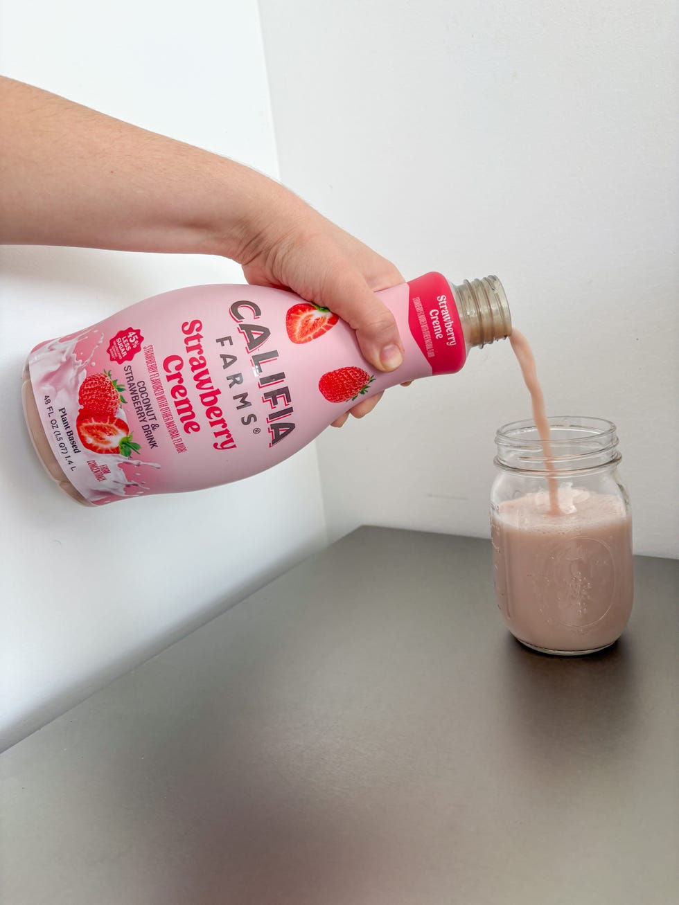 pouring califia farms strawberry creme refresher