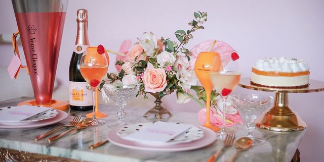 Pink, Table, Peach, Centrepiece, Orange, Room, Sweetness, Champagne stemware, Furniture, Interior design, 