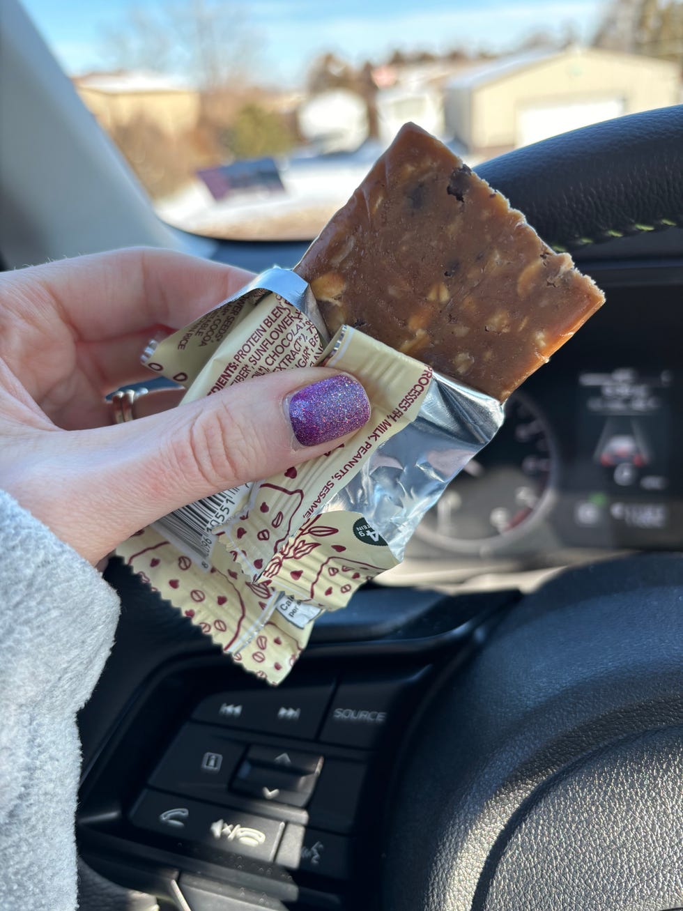 a gh+ taste tester trying a protein bar