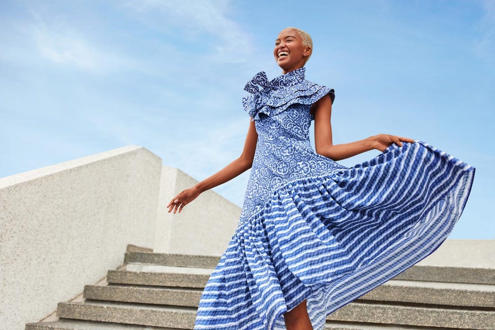 Clothing, Blue, Stairs, Sleeve, Shoulder, Dress, Standing, Joint, One-piece garment, People in nature, 