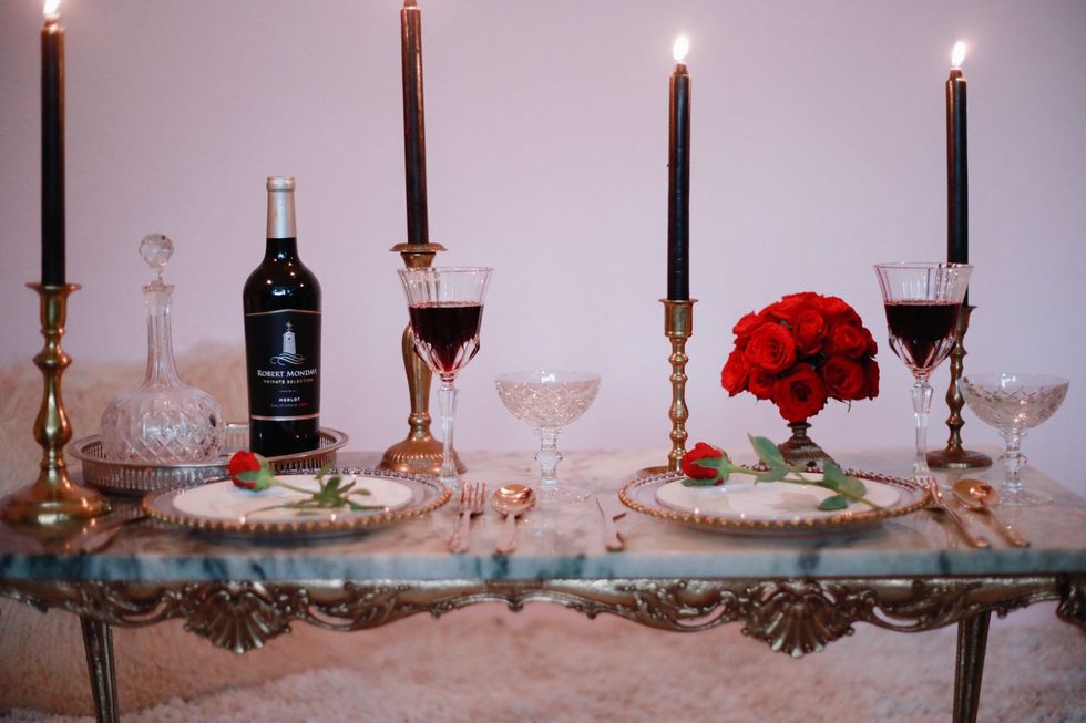 Candle, Lighting, Table, Candle holder, Centrepiece, Wine bottle, Glass bottle, Bottle, Still life photography, Glass, 