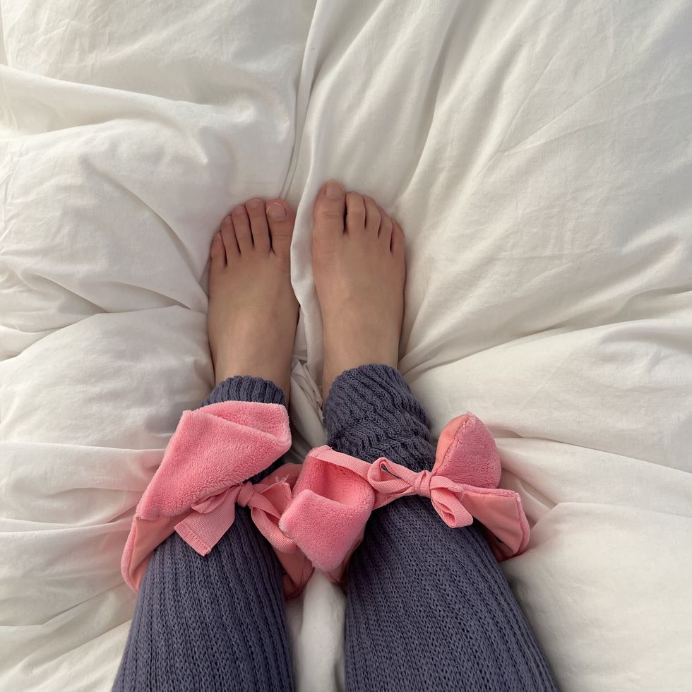 a pair of feet on a bed