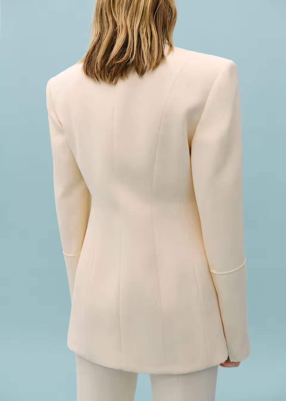 back of a person wearing a white dress