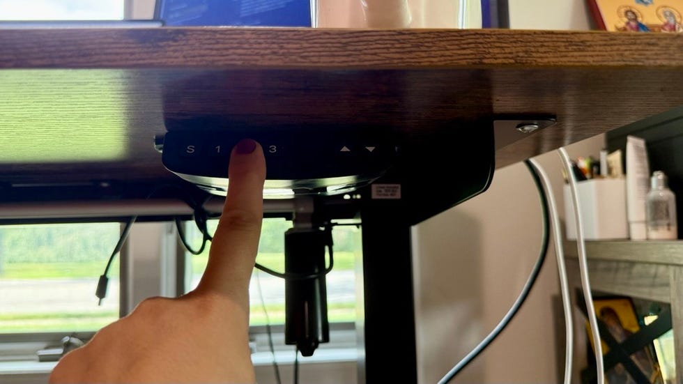 standing desk control panel for an adjustable standing desk featuring preset height options