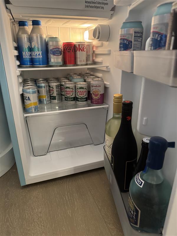 mini refrigerator filled with various beverages