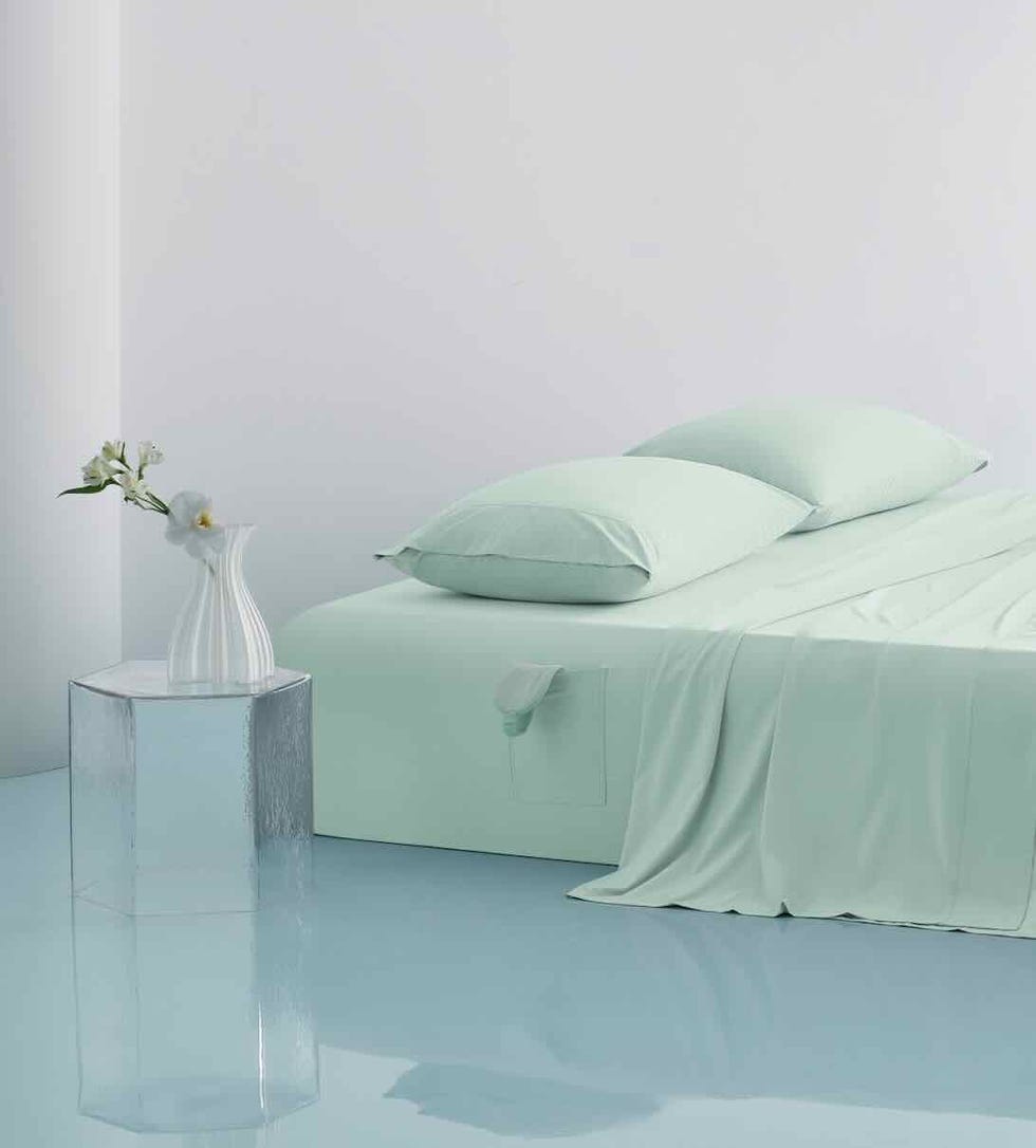 minimalist bedroom setup with a bed and decorative elements