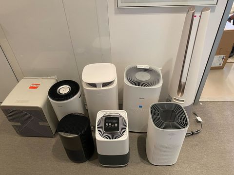 a group of air purifiers awaits testing by experts at the good housekeeping institute