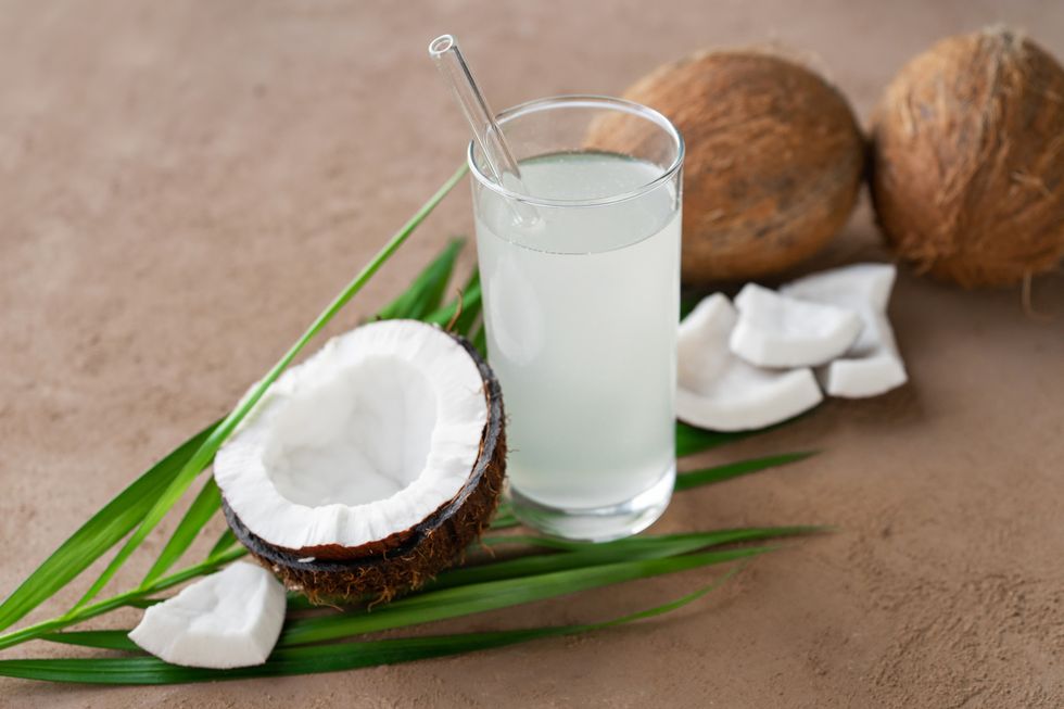 coconut water, coconuts and palm leaf