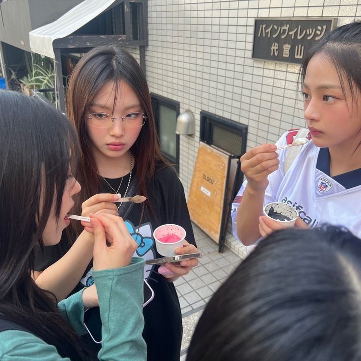 a group of girls eating ice cream