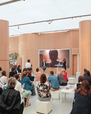 a group of people watching a presentation