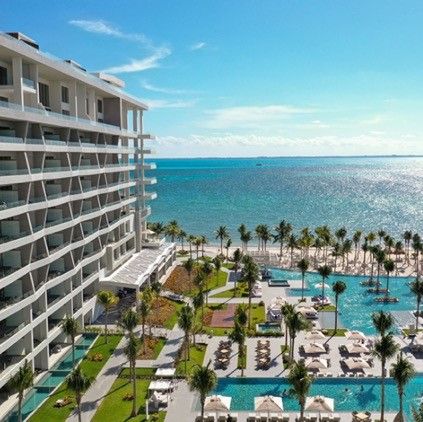 the hotel, pool and beach at garza blanca resort and spa cancun, a good housekeeping pick for best all inclusive family resorts