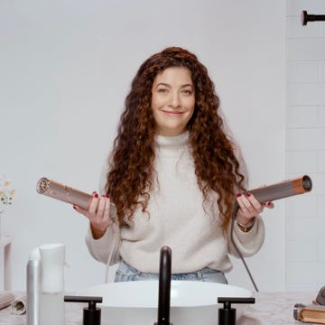 a person a dyson airwrap and shark flexstyle a person a dyson airwrap and shark flexstyle