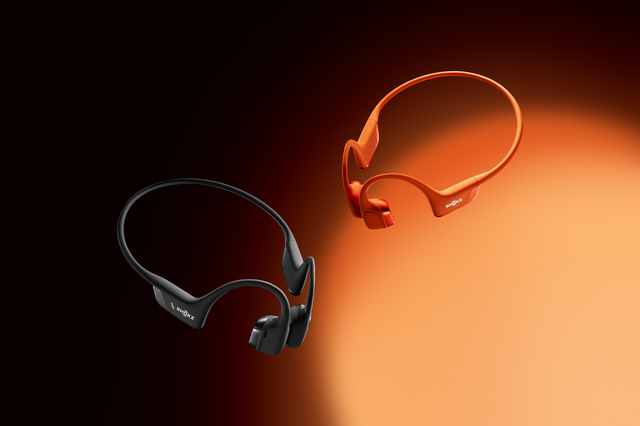 a red and a black pair of bone conduction headphones against a black and red gradient background