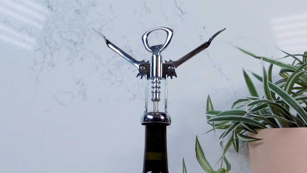 how to open a wine bottle  winged corkscrew