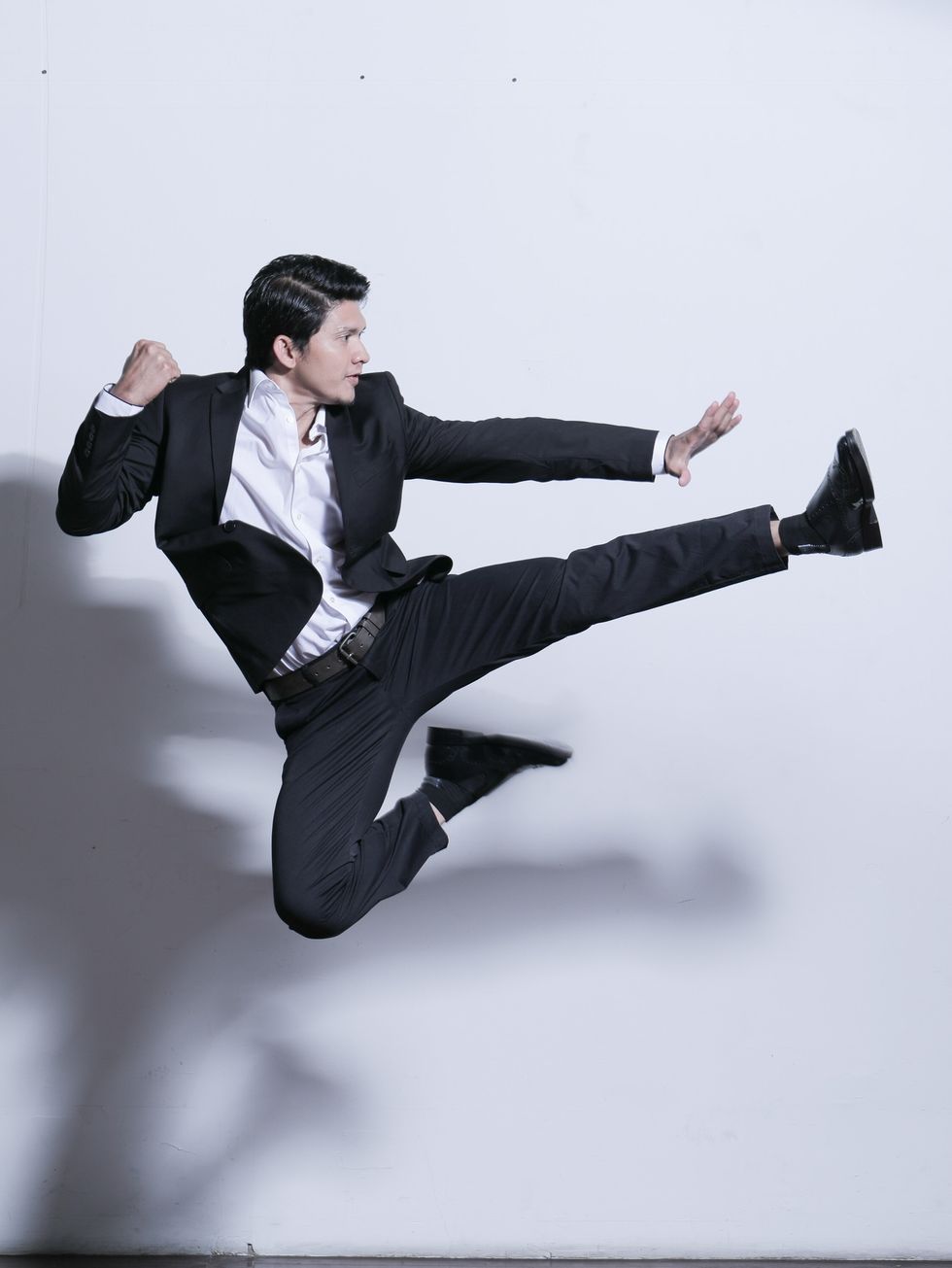 Suit, Kick, Jumping, Formal wear, Leg, Photography, Sitting, Dancer, Tuxedo, Photo shoot, 