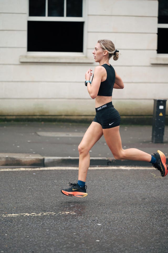 a woman running on a street