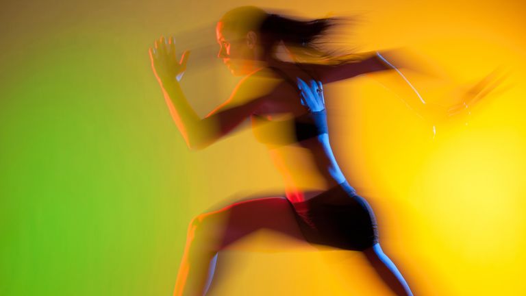 woman running on neon background