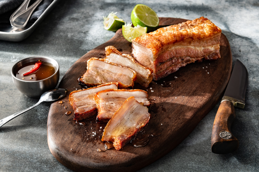 a plate of sliced pork belly