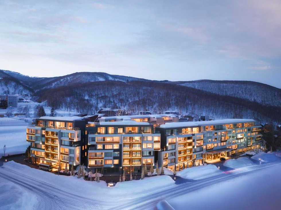 a building with many windows in the snow