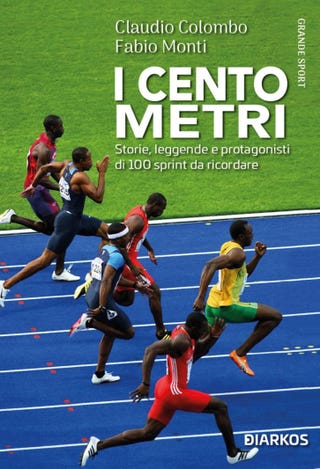 a group of athletes running on a track