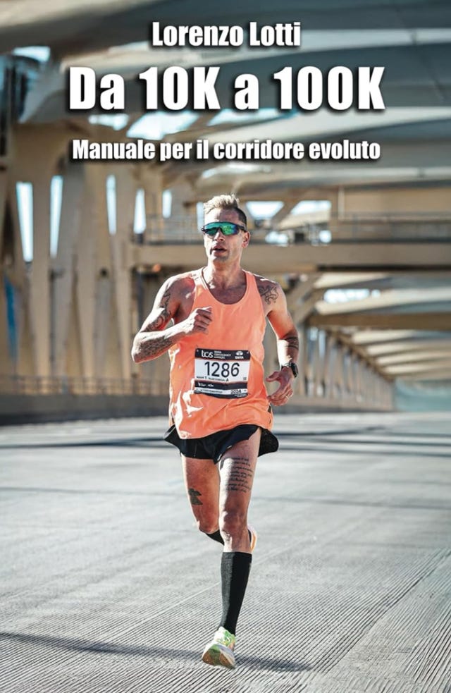 a runner competing in a marathon wearing an orange tank top and black shorts