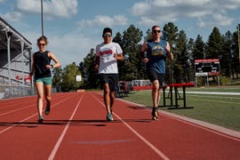 three runners on a track