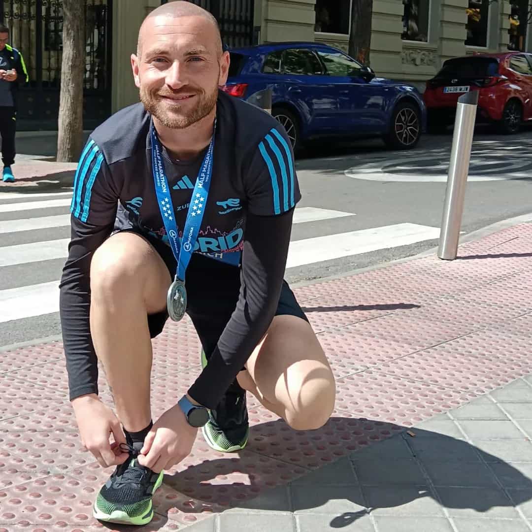 a person sitting on the sidewalk