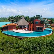 Natural landscape, Property, Resort, Estate, House, Real estate, Caribbean, Vacation, Building, Swimming pool, 