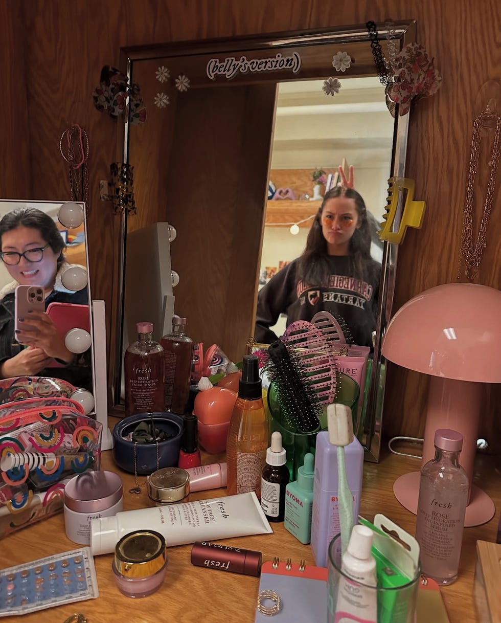 dressing table mirror with various beauty and skincare products displayed