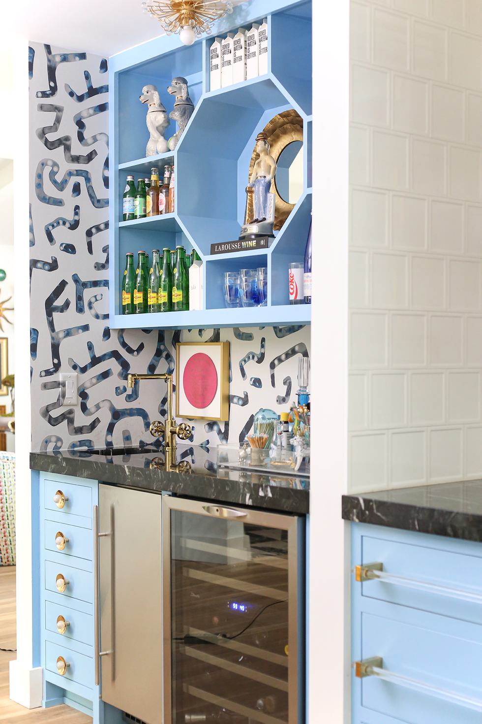 blue at home bar with patterned wallpaper