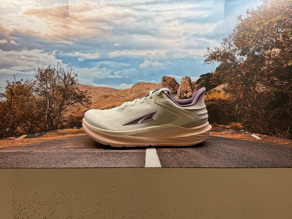 running shoe displayed on a roadway backdrop