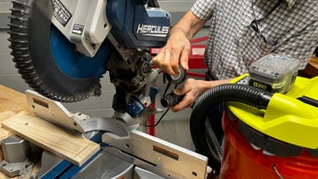 roy using a dust control hack to keep his wood working space clear of wood debris