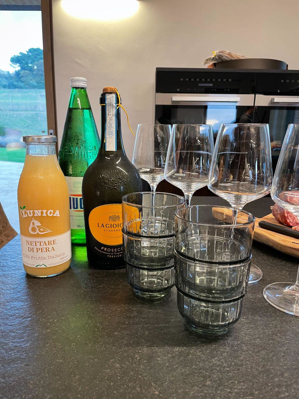 a group of bottles and glasses on a table