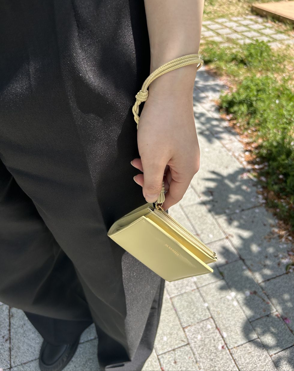 a person holding a yellow belt