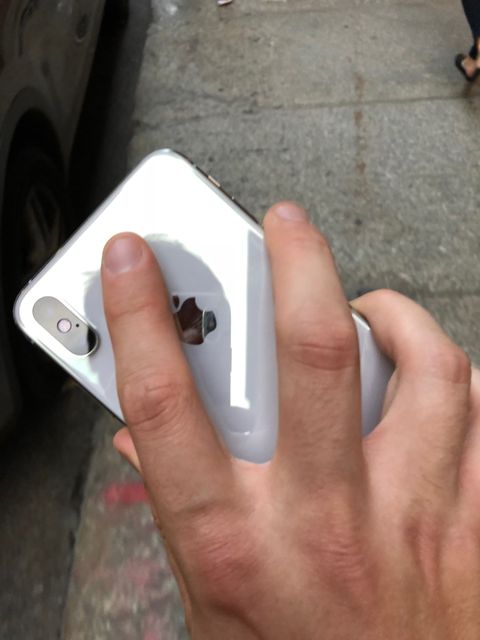 Finger, Gadget, Hand, Nail, Smartphone, Mobile phone, Technology, Electronic device, Material property, Bumper, 
