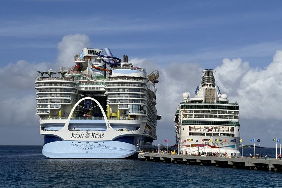 a couple of cruise ships at a dock