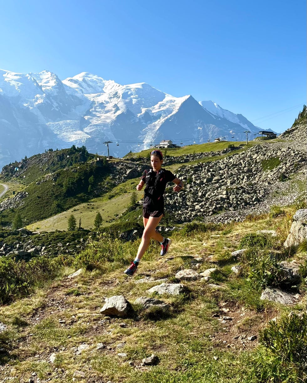 woman running on mountain trails