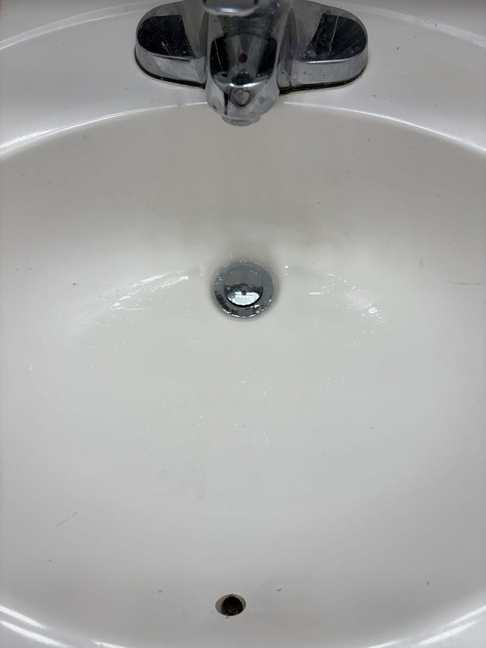 sink basin with faucet and drain