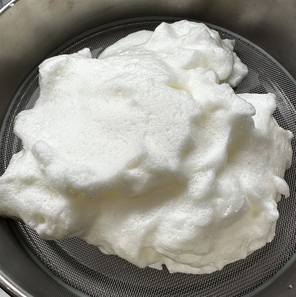 how we test stand mixers whipped egg whites on fine mesh strainer