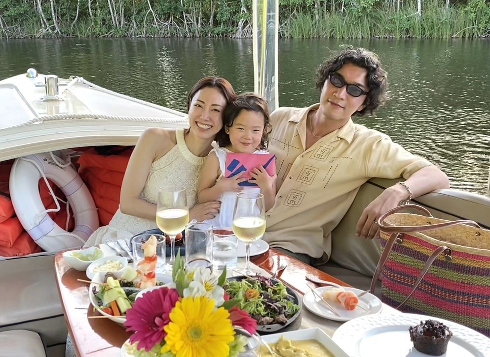 a family sitting on a boat