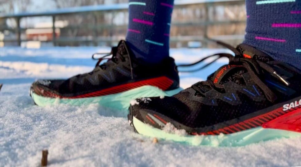 shoes designed for running on snowcovered terrain featuring bright colors