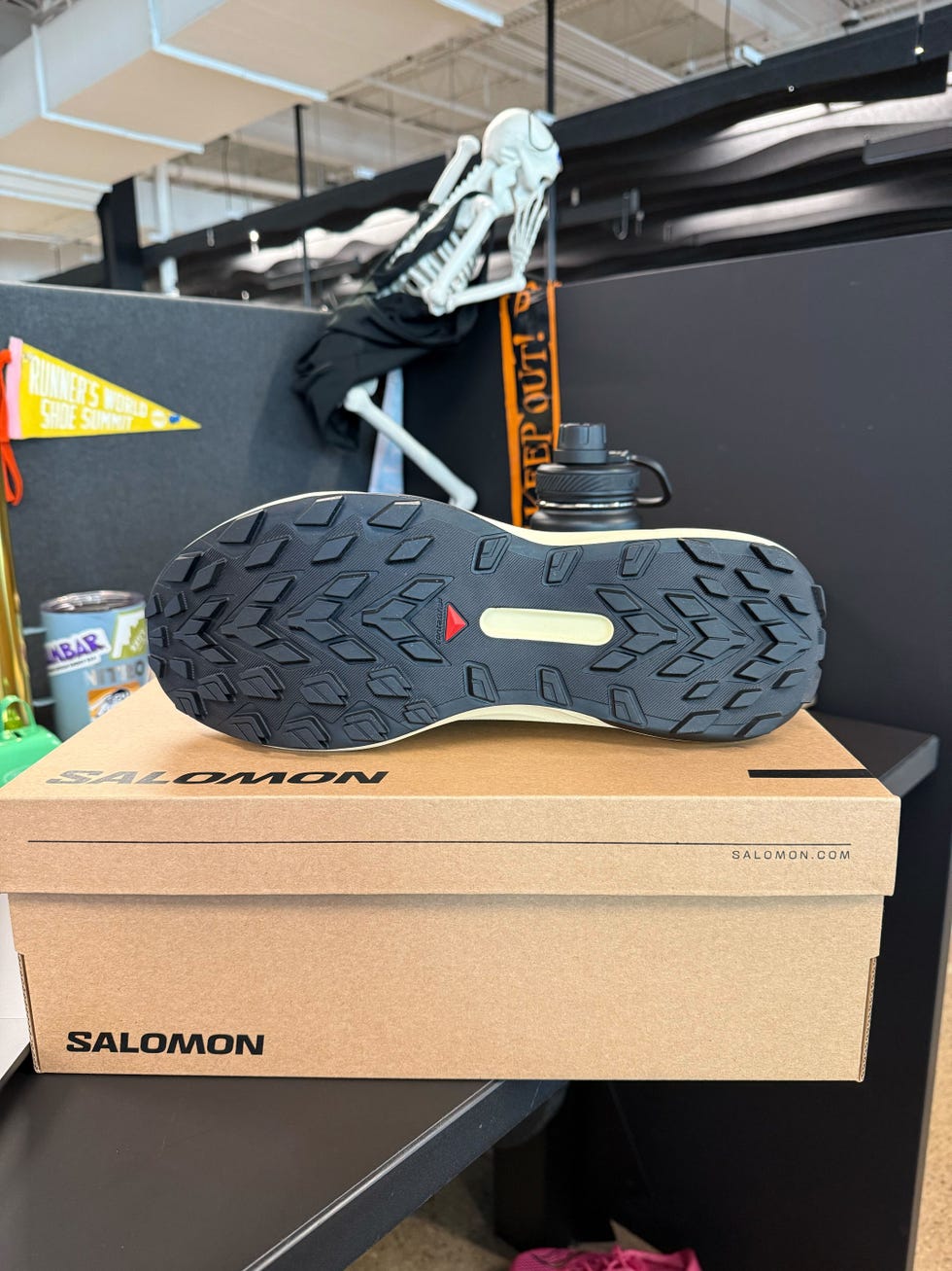 bottom view of a running shoe placed on a cardboard box