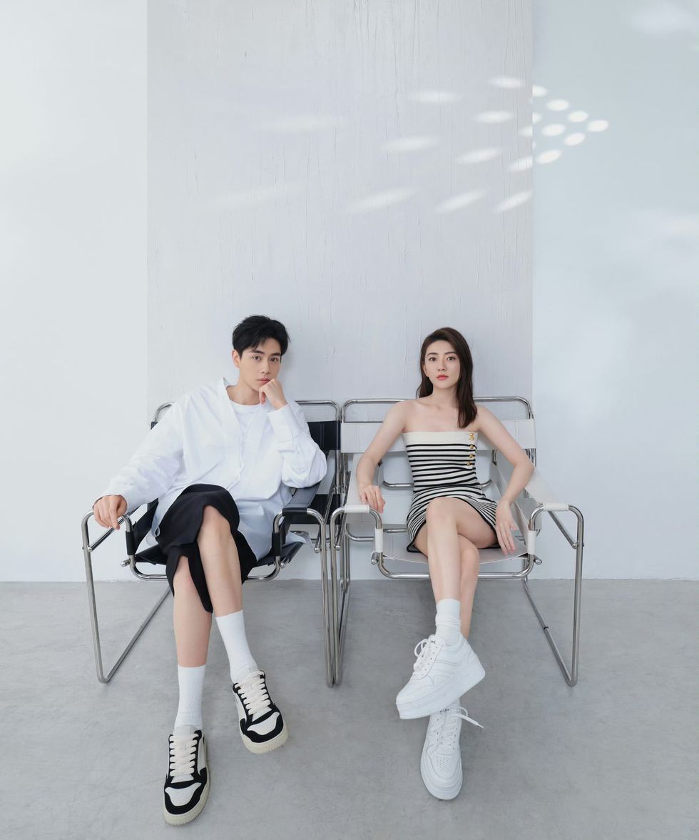 a man and woman sitting in chairs