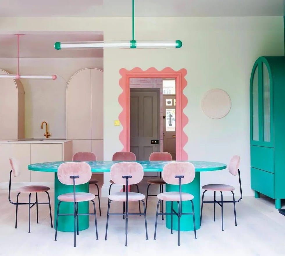 modern dining area featuring a round table and colorful decor