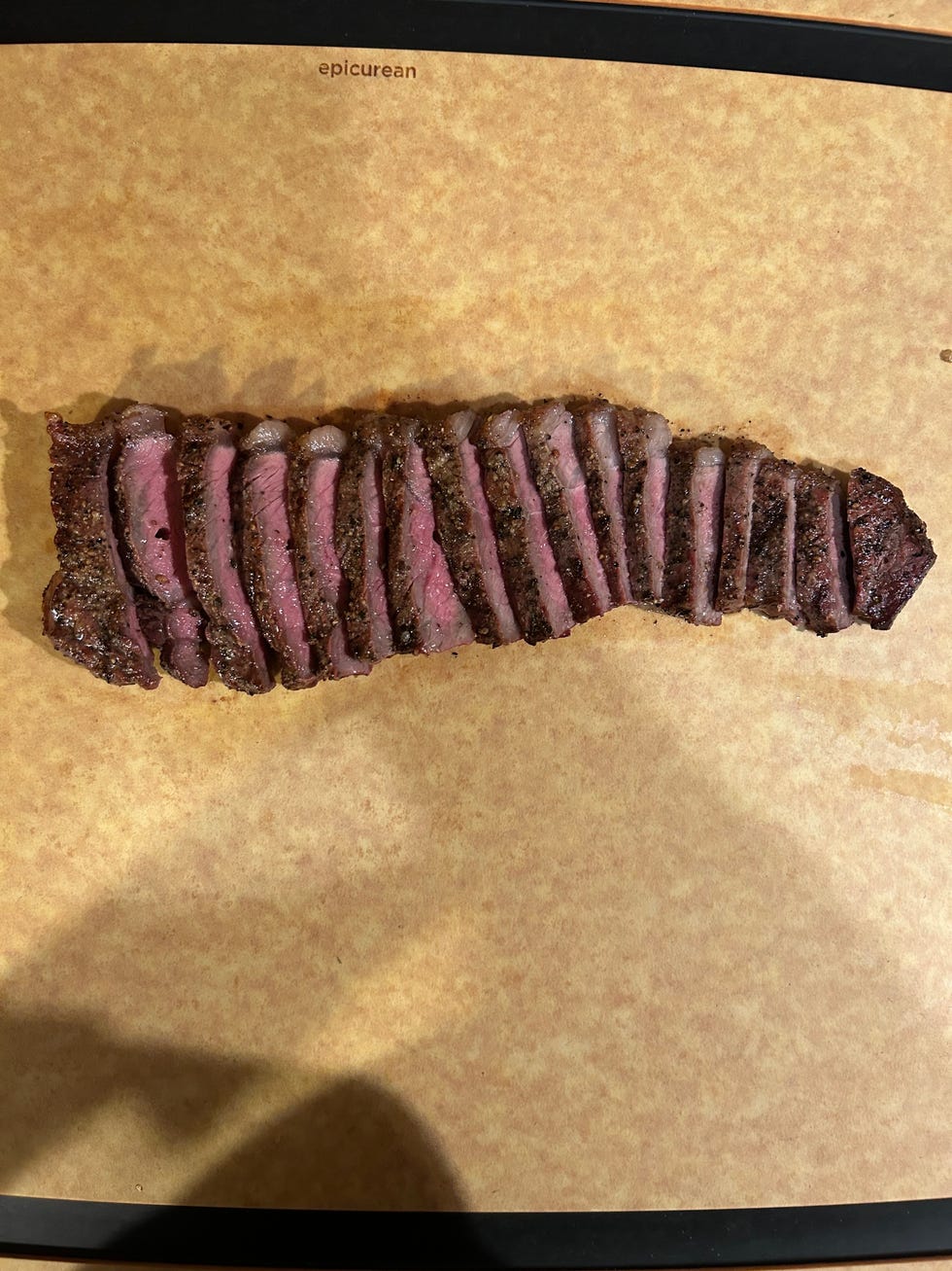 steak sliced on board