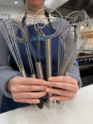 a variety of different sizes and shapes of whisks