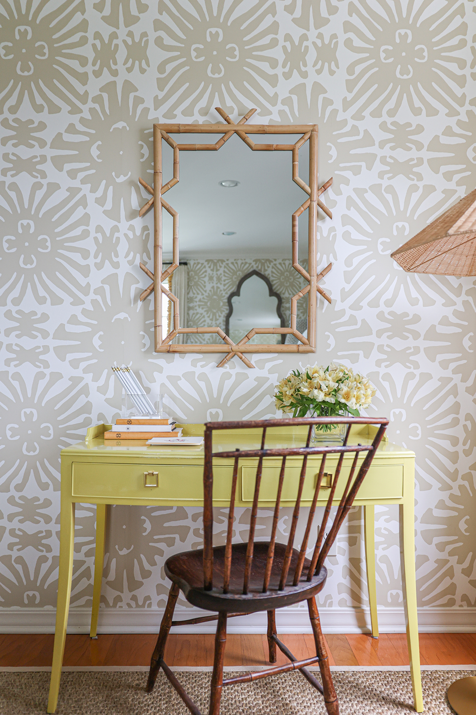 yellow desk with wooden chair and mirror