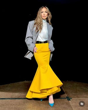 a woman wearing a yellow skirt